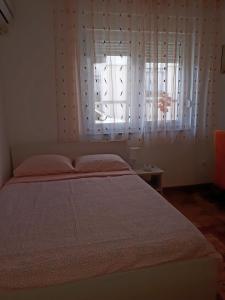 Postel nebo postele na pokoji v ubytování Apartman Ana