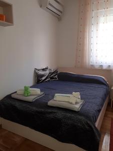 Postel nebo postele na pokoji v ubytování Apartman Ana