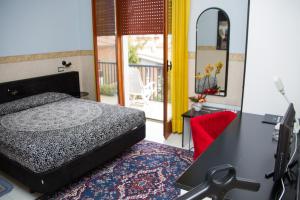 Postel nebo postele na pokoji v ubytování Hotel Letizia