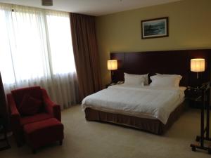 Postel nebo postele na pokoji v ubytování Gaya Centre Hotel