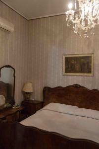 Postel nebo postele na pokoji v ubytování Hotel Letizia