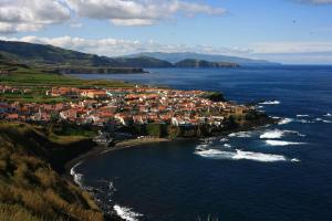 an aerial view of a town on the shore of the ocean at Mar de Prata in Maia