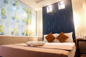 Postel nebo postele na pokoji v ubytování Great Hill Resort