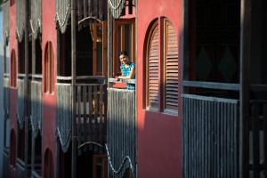 a person sitting at a window of a train at Amnaya Resort Kuta in Kuta
