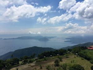 a view of the ocean from the top of a hill at AMS Staycation at Wind Residences in Tagaytay