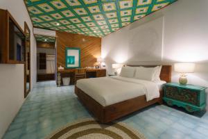 Postel nebo postele na pokoji v ubytování Rawa Lombok
