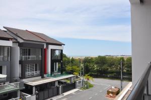 an apartment balcony with a view of a parking lot at Imperial Cottage in Melaka
