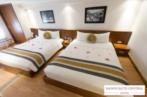 Rúm í herbergi á Elite Central Hotel Hanoi