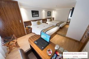 Rúm í herbergi á Elite Central Hotel Hanoi