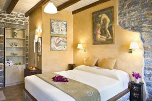 Кровать или кровати в номере Elixirion Guest House