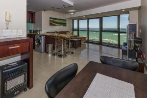 a living room with a view of the ocean at 1102 Ocean View in Strand