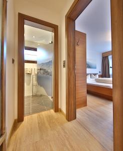 Postel nebo postele na pokoji v ubytování Hotel Garni Fiegl Apart