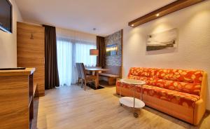 TV a/nebo společenská místnost v ubytování Hotel Garni Fiegl Apart