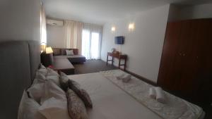 Postel nebo postele na pokoji v ubytování Family Hotel Muses
