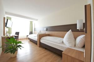 Cama o camas de una habitación en Hotel zur Riss