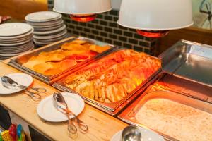 a table with two trays of food on top at Alfagar Alto da Colina in Albufeira
