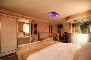 a bedroom with a large bed in a room at Hotel Harmony in Kutaisi