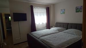 Voodi või voodid majutusasutuse Ferienwohnung Loreley toas