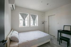 Postel nebo postele na pokoji v ubytování Guest House Diphylleia Grayi