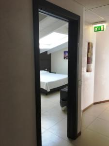 A bed or beds in a room at Residenza S.Event B&B