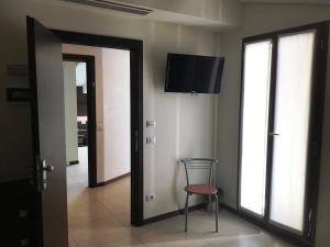 A television and/or entertainment centre at Residenza S.Event B&B