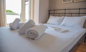 A bed or beds in a room at Villa Riza