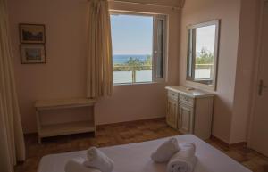 A bed or beds in a room at Villa Riza