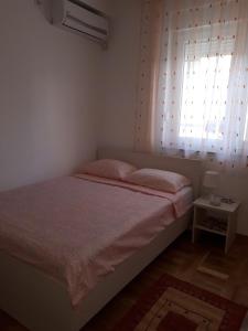 Postel nebo postele na pokoji v ubytování Apartman Ana