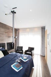 Een bed of bedden in een kamer bij Luxe B&B Het Colmerhof
