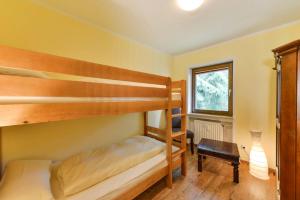Ein Bett oder Betten in einem Zimmer der Unterkunft Alpen Deluxe Oberammergau
