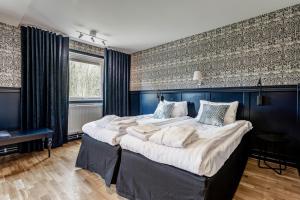 Katil atau katil-katil dalam bilik di Hällsnäs Hotell & Restaurang