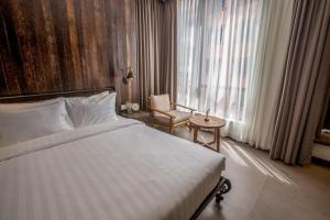 Postel nebo postele na pokoji v ubytování SIM Boutique Hotel
