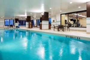 a swimming pool with blue water in a building at Hyatt Place Nashville Downtown in Nashville