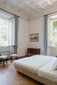 A bed or beds in a room at Classic Hotel