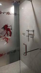 a shower with a glass door in a bathroom at Privilege in Coatzacoalcos