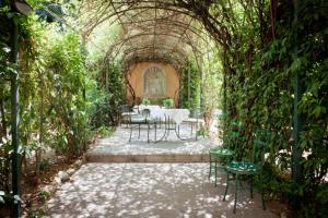 A garden outside Classic Hotel
