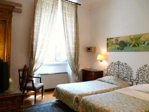 A bed or beds in a room at Classic Hotel