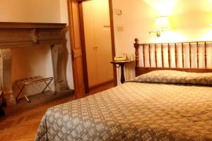 A bed or beds in a room at Classic Hotel