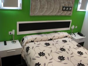 Posteľ alebo postele v izbe v ubytovaní Hotel Elizalde