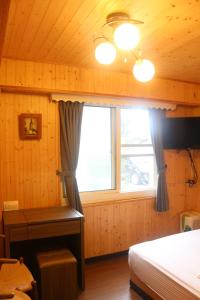 Voodi või voodid majutusasutuse Wankou Hotel toas
