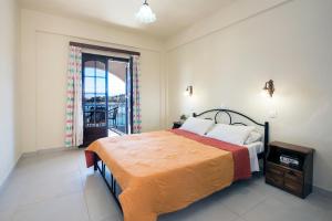 מיטה או מיטות בחדר ב-Dimitrios Apartments