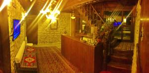 a room with a staircase and a counter in a building at Beybagi Konak Hotel in Safranbolu