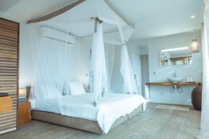 מיטה או מיטות בחדר ב-Les Palétuviers