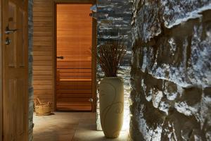 a large white vase sitting in front of a door at Hotel Stará Pekárna s privátním wellness in Liberec