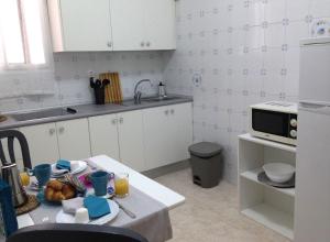 Kuchyňa alebo kuchynka v ubytovaní Margall Home