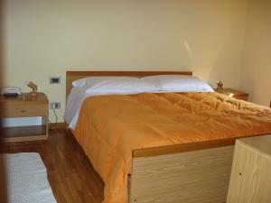 Een bed of bedden in een kamer bij Albergo Ristorante Taverna dalla "Lisina"