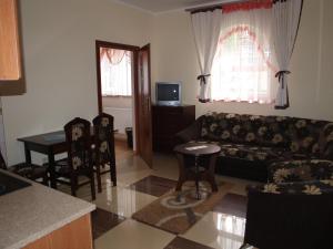 a living room with a couch and a table at Apartamenty Willa Park in Żagań