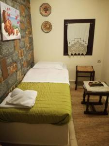 Tempat tidur dalam kamar di Fissi Villas agritourism accommodation near the sea