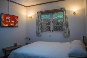 Postel nebo postele na pokoji v ubytování Mount Mary Inn