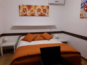 Letto o letti in una camera di Albergo Ollolai